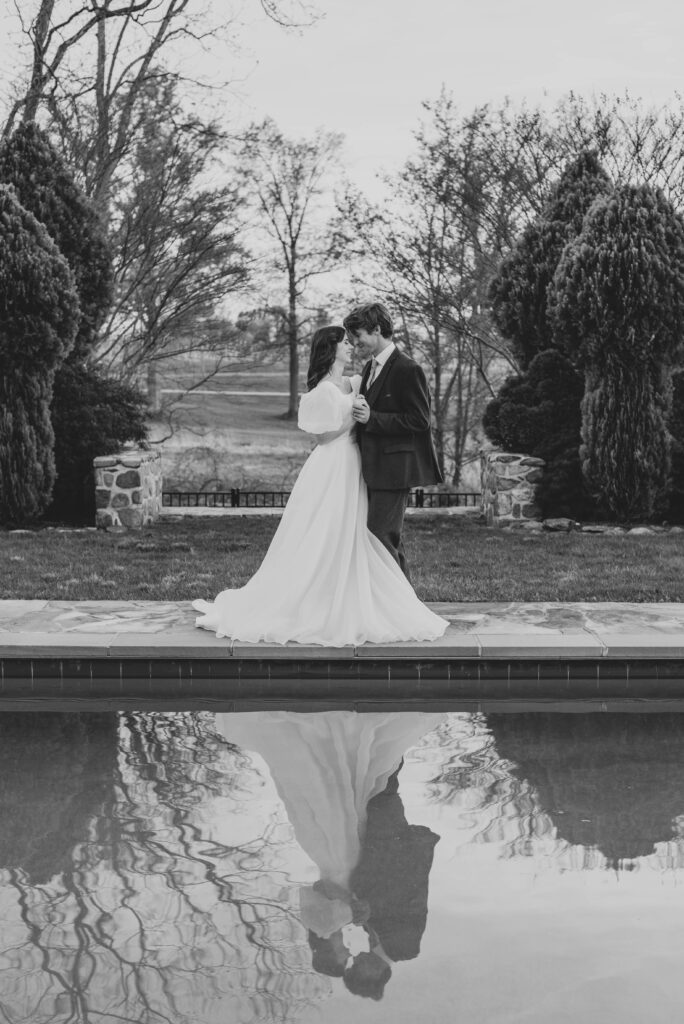 bride and groom dance alongside pool at Heigh Torr Estate