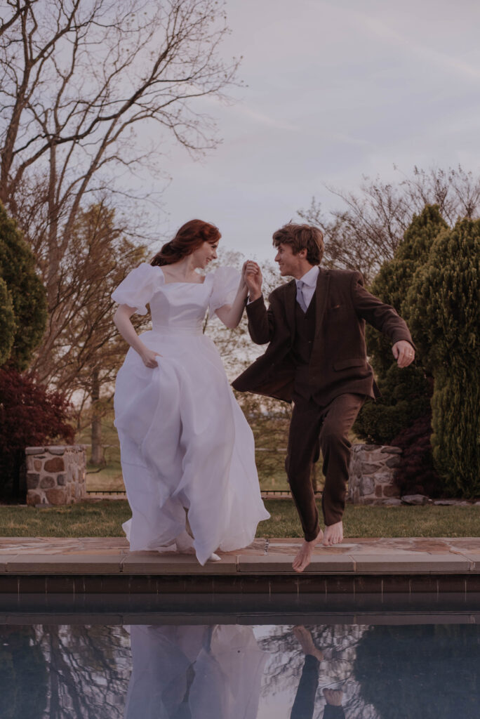 bride and groom jump into the pool at Heigh Torr Estate wedding