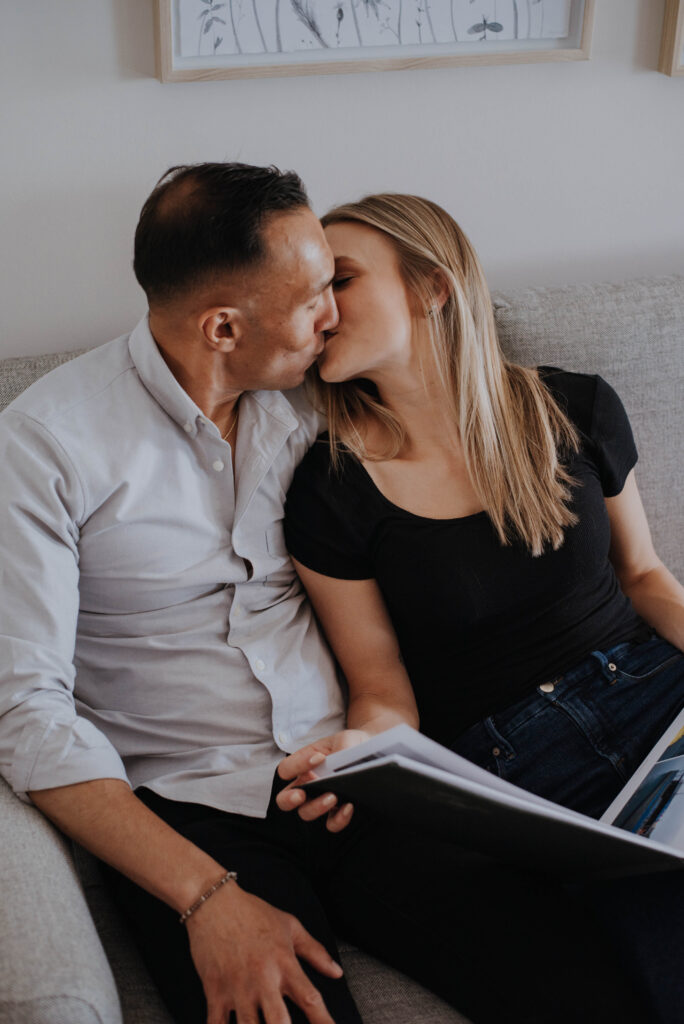 Couple kissing on couch