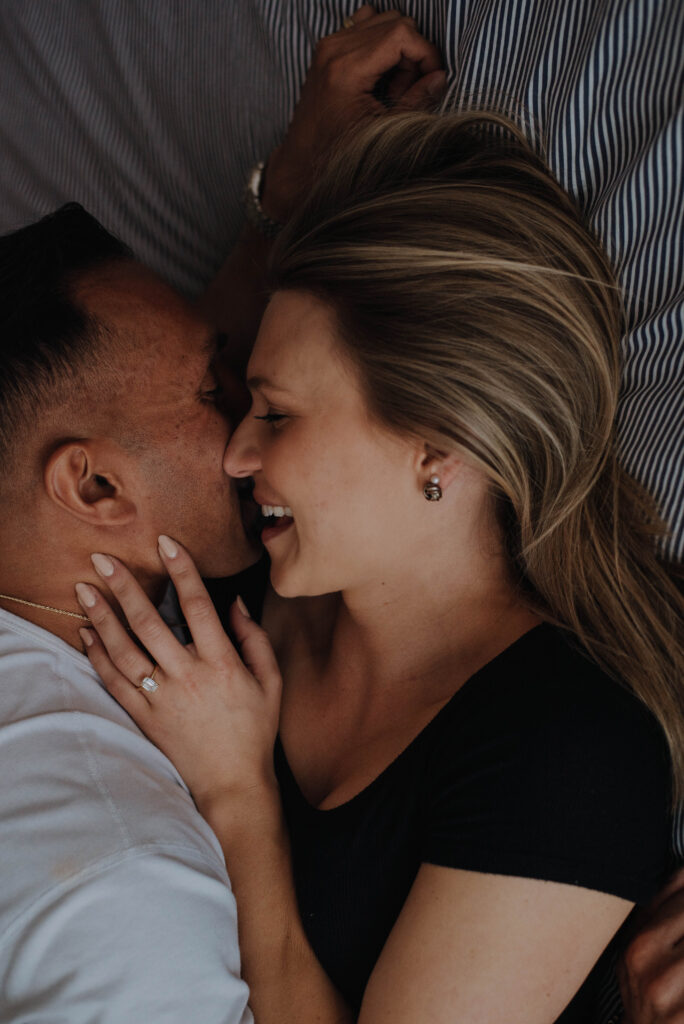 Couple cuddling in bed