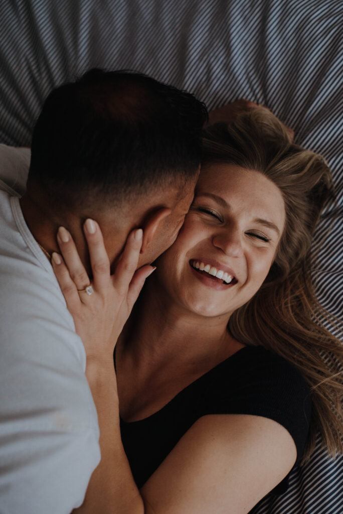 Couple kissing on bed