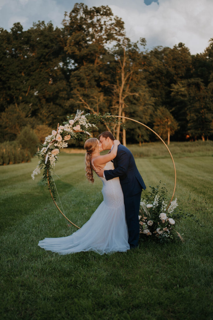 wedding ceremony on the lawn at barn wedding venue