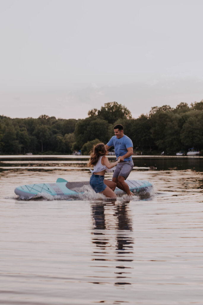 Couple jumping in water