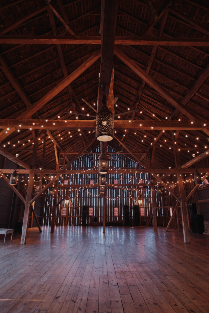 inside of Riverside on the Potomac barn wedding venue with string lighting