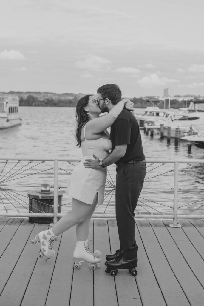 Couple kissing at Alexandria VA boardwalk